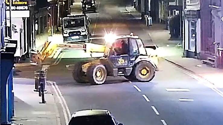 Stolen heavy machinery used to remove an ATM from a building wall in the United Kingdom