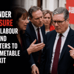 UK Prime Minister Keir Starmer walking outside during a public visit, appearing deep in thought amid a political crisis.