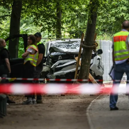 Police officers securing an area in Berlin following the Pride attack investigation