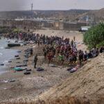 Large numbers of migrants entering the Spanish enclave of Ceuta as security forces respond