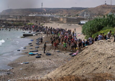Large numbers of migrants entering the Spanish enclave of Ceuta as security forces respond