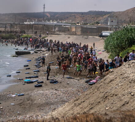 Large numbers of migrants entering the Spanish enclave of Ceuta as security forces respond