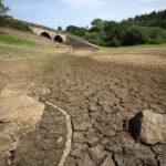 Dry riverbed and low reservoir levels in Wales following prolonged dry weather