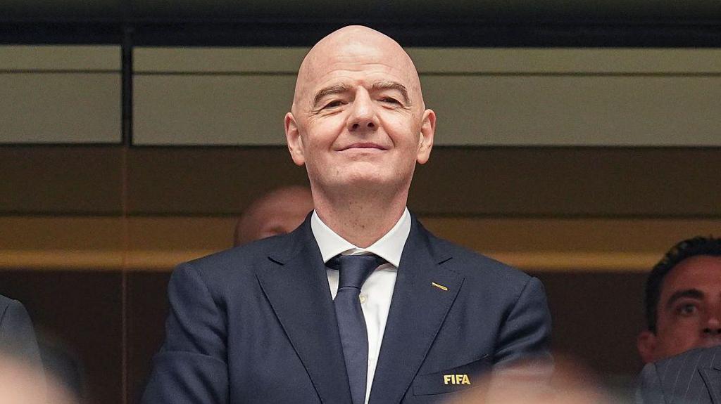 FIFA President Gianni Infantino with the FIFA World Cup trophy during discussions on tournament expansion