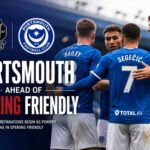 Portsmouth players warming up before the pre-season friendly against Woking