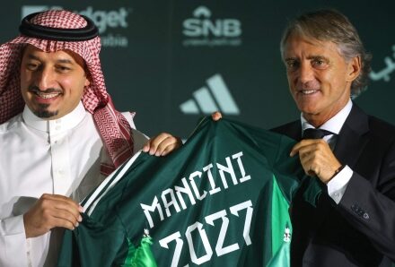 Roberto Mancini gestures from the touchline while coaching Italy during an international football match.