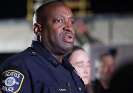 Police officers respond to a shooting near the Space Needle during a food festival in Seattle