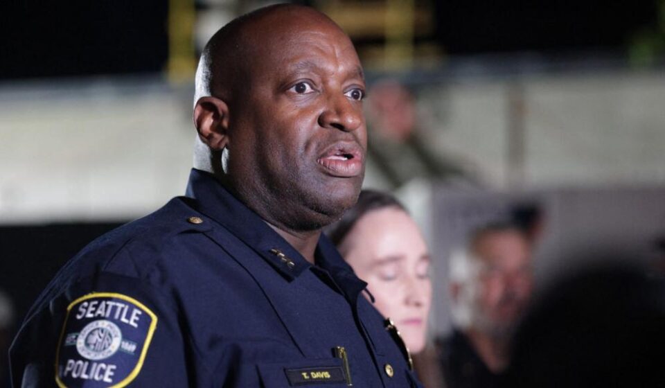 Police officers respond to a shooting near the Space Needle during a food festival in Seattle