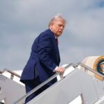 Donald Trump boarding the older Air Force One aircraft during rising Iran tensions