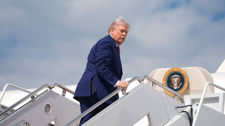 Donald Trump boarding the older Air Force One aircraft during rising Iran tensions