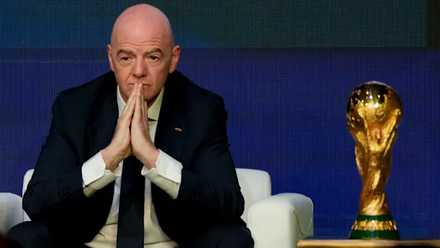 FIFA and UEFA logos representing reports about a potential sale of World Cup commercial stakes
