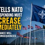 NATO flags outside alliance headquarters as the United States calls for higher defense spending by member countries.