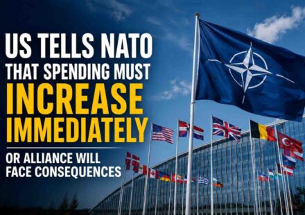 NATO flags outside alliance headquarters as the United States calls for higher defense spending by member countries.