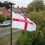 Union flags hanging across a UK street amid political controversy