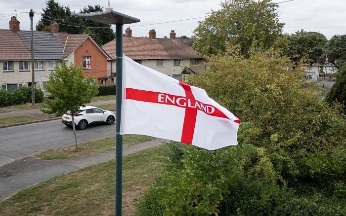 Union flags hanging across a UK street amid political controversy