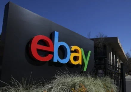 eBay logo with legal documents representing the company's $50 million cyberstalking settlement